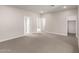 Open living room with neutral walls and plush carpeting at 4925 W Beryl Ave, Glendale, AZ 85302