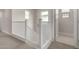 This image shows a staircase with white banisters and neutral carpeting at 4925 W Beryl Ave, Glendale, AZ 85302