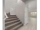 Carpeted staircase with white railing leading to the second floor at 4925 W Beryl Ave, Glendale, AZ 85302