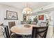 Round dining table with six chairs sits in the dining room at 9427 W Garnette Dr, Sun City, AZ 85373