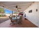 Covered patio with seating area, ceiling fan, and view of the backyard at 9650 N 18Th St, Phoenix, AZ 85020