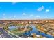 Community overview showcasing lake, walking paths, and homes at 18849 E Azalea Dr, Queen Creek, AZ 85142