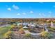 Aerial view showing playground and shaded areas near the lake at 18849 E Azalea Dr, Queen Creek, AZ 85142