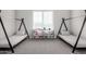 Cozy bedroom with twin beds and built in storage at 18849 E Azalea Dr, Queen Creek, AZ 85142
