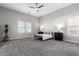 Large bedroom with a queen bed and ceiling fan at 18849 E Azalea Dr, Queen Creek, AZ 85142