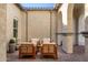 Private courtyard with wooden seating and desert landscaping at 18849 E Azalea Dr, Queen Creek, AZ 85142