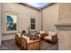 Private courtyard with wooden seating and desert landscaping at 18849 E Azalea Dr, Queen Creek, AZ 85142