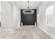 Elegant dining room featuring a statement wall and modern chandelier at 18849 E Azalea Dr, Queen Creek, AZ 85142