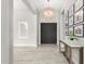 Bright and spacious entryway with modern chandelier and console table at 18849 E Azalea Dr, Queen Creek, AZ 85142