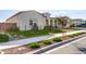 Landscaped front yard with artificial turf and desert plants at 18849 E Azalea Dr, Queen Creek, AZ 85142