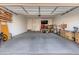 This garage is spacious and well-organized, featuring ample storage and a dedicated workbench area, perfect for DIY projects at 18849 E Azalea Dr, Queen Creek, AZ 85142