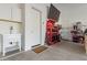 Well-equipped workshop area in garage, featuring workbench, tools, and storage at 18849 E Azalea Dr, Queen Creek, AZ 85142