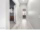 Light-filled hallway with wood-look floors at 18849 E Azalea Dr, Queen Creek, AZ 85142