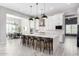 Open concept kitchen featuring white cabinetry and large island at 18849 E Azalea Dr, Queen Creek, AZ 85142