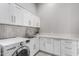 White shaker cabinets, quartz countertops, LG washer and dryer, and a clean design at 18849 E Azalea Dr, Queen Creek, AZ 85142