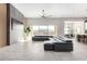 Spacious living room, featuring a large sectional sofa and stone fireplace at 18849 E Azalea Dr, Queen Creek, AZ 85142