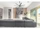 Open living area with sectional sofa and modern TV wall at 18849 E Azalea Dr, Queen Creek, AZ 85142