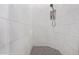 Clean and bright shower with marble-style tile and a niche at 18849 E Azalea Dr, Queen Creek, AZ 85142