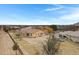 Aerial view showing the house's back, highlighting the yard and a neighboring property at 24002 S 201St Ct, Queen Creek, AZ 85142