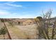 Aerial view of house's back, emphasizing the large yard and surrounding landscape at 24002 S 201St Ct, Queen Creek, AZ 85142