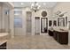Luxurious Primary bathroom with double vanities, a soaking tub and separate shower at 24002 S 201St Ct, Queen Creek, AZ 85142