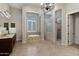 Elegant Primary bathroom with a large soaking tub, double sinks and a walk-in shower at 24002 S 201St Ct, Queen Creek, AZ 85142