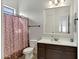 Clean bathroom with shower/tub combo and dark wood vanity at 24002 S 201St Ct, Queen Creek, AZ 85142