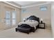 Spacious Primary bedroom with a plush bed and plenty of natural light at 24002 S 201St Ct, Queen Creek, AZ 85142