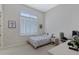 Cozy bedroom with a desk, chair, and a bed featuring a calming color scheme at 24002 S 201St Ct, Queen Creek, AZ 85142