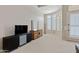 Bedroom with large window and built-in dresser, offering plenty of storage space at 24002 S 201St Ct, Queen Creek, AZ 85142