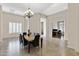 Dining room with a marble table and modern chandelier at 24002 S 201St Ct, Queen Creek, AZ 85142