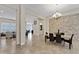 Spacious dining room with stone accent wall and chandelier at 24002 S 201St Ct, Queen Creek, AZ 85142