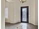 Elegant entryway featuring a decorative door and tile flooring at 24002 S 201St Ct, Queen Creek, AZ 85142