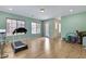 Exercise room with wood floors, access to backyard, and plenty of natural light at 24002 S 201St Ct, Queen Creek, AZ 85142