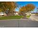 Stone house with autumn trees and paved driveway at 24002 S 201St Ct, Queen Creek, AZ 85142
