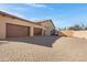 Spacious three-car garage with brick-paved driveway, offering ample parking at 24002 S 201St Ct, Queen Creek, AZ 85142