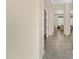 Bright hallway with tile flooring leading to living areas at 24002 S 201St Ct, Queen Creek, AZ 85142