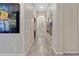 Bright hallway with tile flooring and two large framed pictures on the wall at 24002 S 201St Ct, Queen Creek, AZ 85142