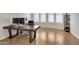 Spacious home office with built-in shelving and wood desk at 24002 S 201St Ct, Queen Creek, AZ 85142