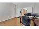 Home office with desk and view into dining area at 24002 S 201St Ct, Queen Creek, AZ 85142
