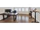 Home office with wood flooring and large desk at 24002 S 201St Ct, Queen Creek, AZ 85142