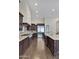 Modern kitchen with stainless steel appliances and ample counter space at 24002 S 201St Ct, Queen Creek, AZ 85142