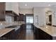 Spacious kitchen features granite countertops, stainless steel appliances, and ample cabinetry at 24002 S 201St Ct, Queen Creek, AZ 85142