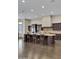 Gourmet kitchen with dark wood cabinetry and granite countertops at 24002 S 201St Ct, Queen Creek, AZ 85142