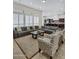 Open living room with a view into the kitchen and plenty of seating at 24002 S 201St Ct, Queen Creek, AZ 85142