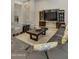 Spacious living room with a large sectional sofa and a built-in entertainment center at 24002 S 201St Ct, Queen Creek, AZ 85142