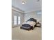 Spacious main bedroom with plush carpet and French doors at 24002 S 201St Ct, Queen Creek, AZ 85142