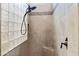 Walk-in shower with glass block wall and neutral tile at 24002 S 201St Ct, Queen Creek, AZ 85142