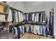 Large walk-in closet with ample hanging space and shelving at 24002 S 201St Ct, Queen Creek, AZ 85142