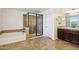 The bathroom boasts tile flooring, a glass shower enclosure, and a soaking tub at 2542 N Riley Rd, Buckeye, AZ 85396